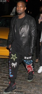 Kanye West sporting an upside down pentagram and Baphomet head on his pants Source