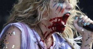 Blood on Ke$ha's face after drinking from a "real" heart on stage. Source